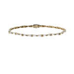 Tapered baguette lab-grown diamond tennis bracelet, 1.92ct in 18K recycled yellow gold.